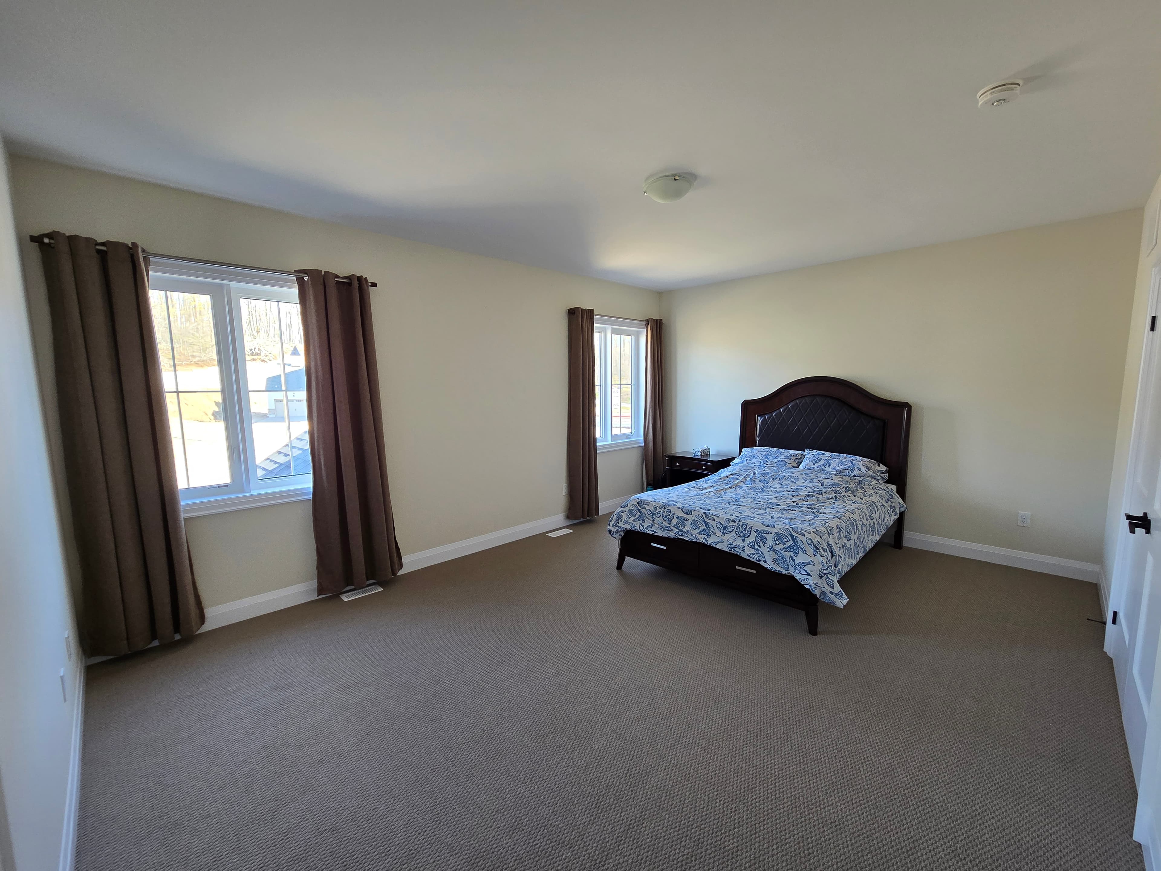 Primary bedroom with forest view